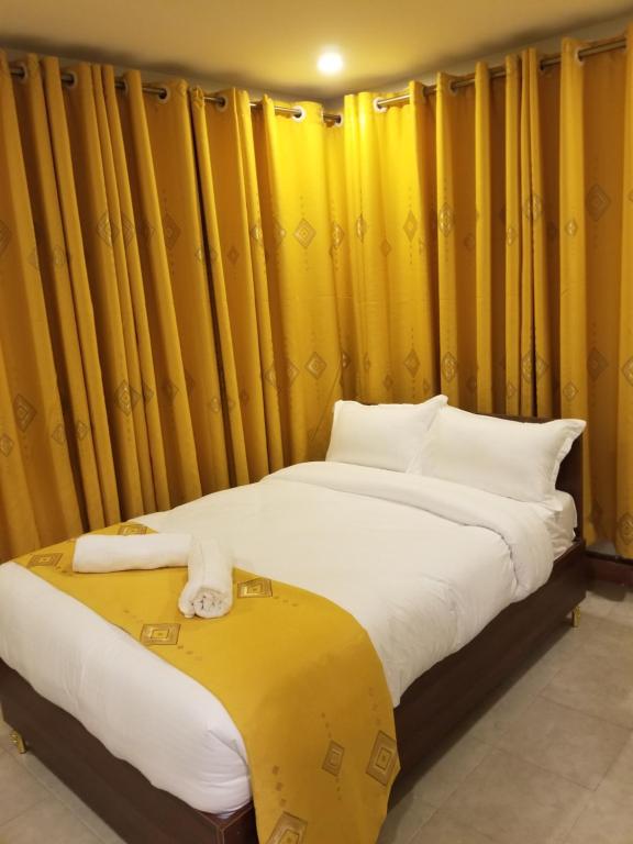 Voodi või voodid majutusasutuse 7 Days Holiday Inn toas