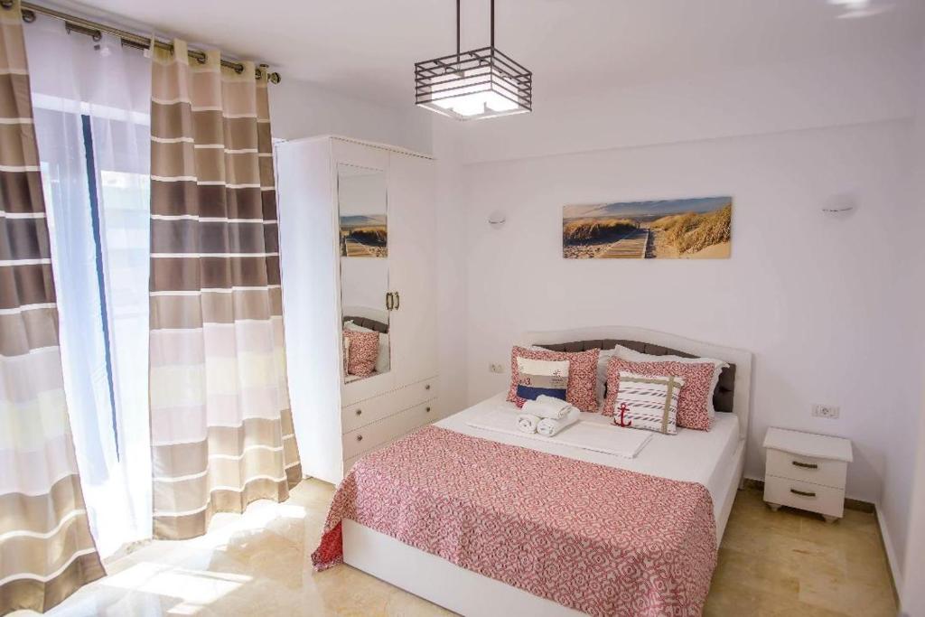 Postel nebo postele na pokoji v ubytování Sophia 2 & Moonlight Apartaments