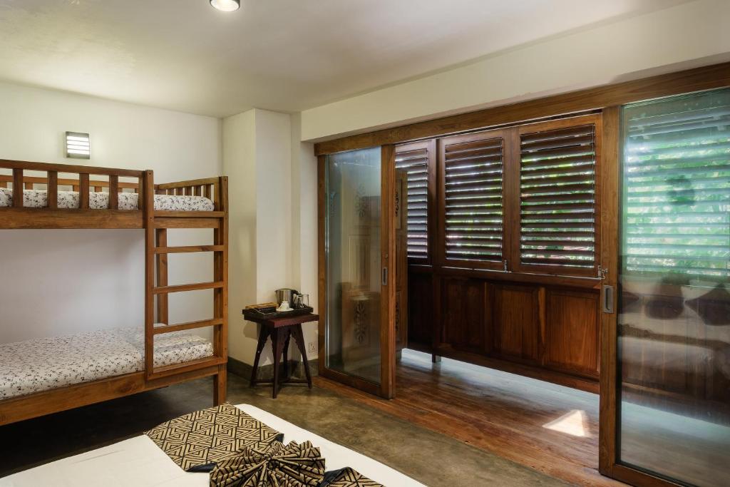 Postel nebo postele na pokoji v ubytování Royal Indigo Villa