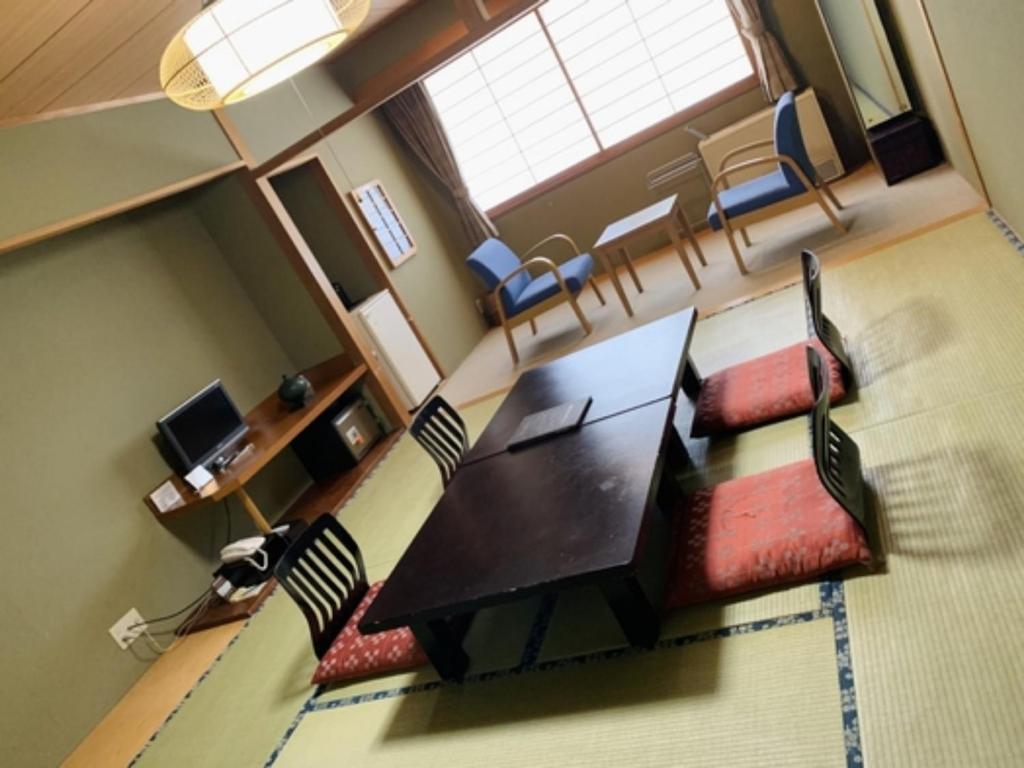 an overhead view of a living room with a table and chairs at Mount View Hotel - Vacation STAY 40095v in Kamikawa