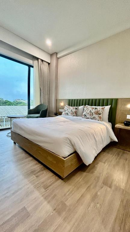 Postel nebo postele na pokoji v ubytování Hotel Limon & Banquet Sector 29, Gurgaon
