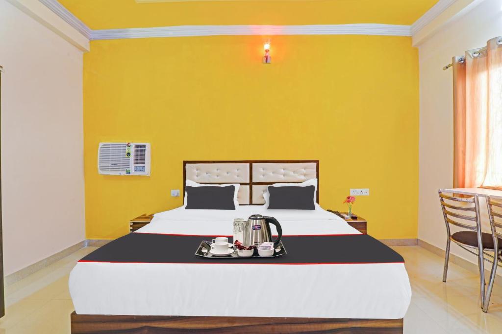 Collection O Sundaram Resort 객실 침대