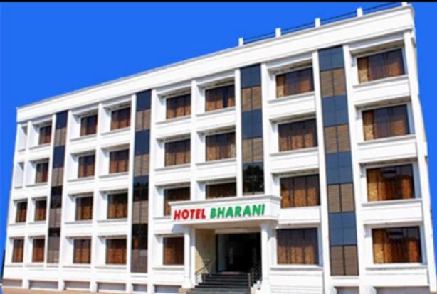 a white building with a north miami sign on it at HOTEL BHARANI in Kanyakumari