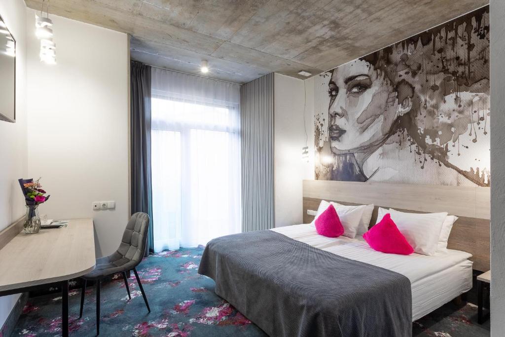 Postel nebo postele na pokoji v ubytování Algiro Hotel
