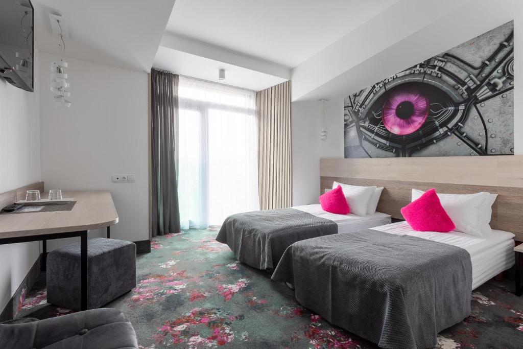 Postel nebo postele na pokoji v ubytování Algiro Hotel
