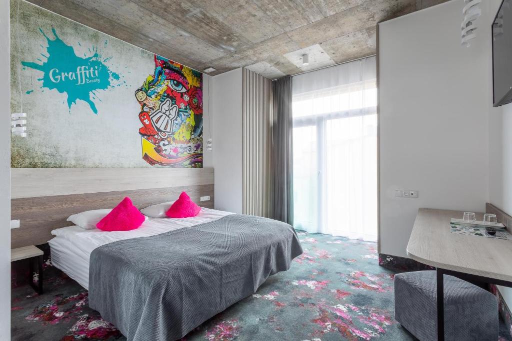 Postel nebo postele na pokoji v ubytování Algiro Hotel