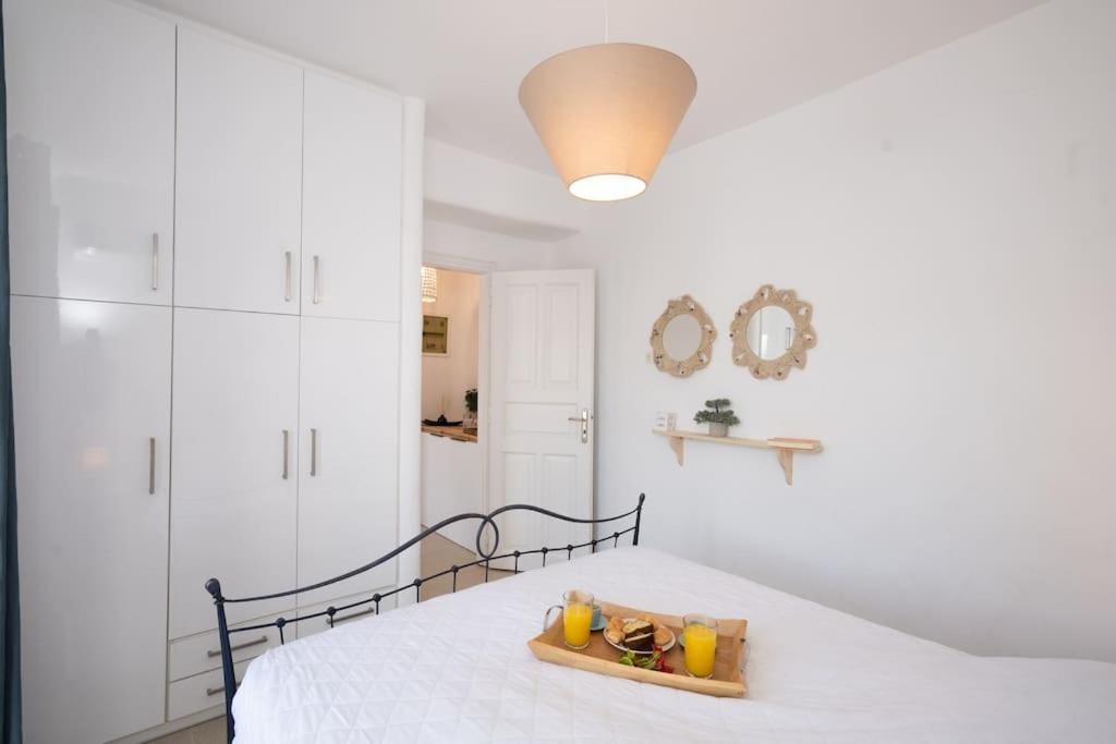Postel nebo postele na pokoji v ubytování ILIOS COZY POOLHOUSE MYKONOS