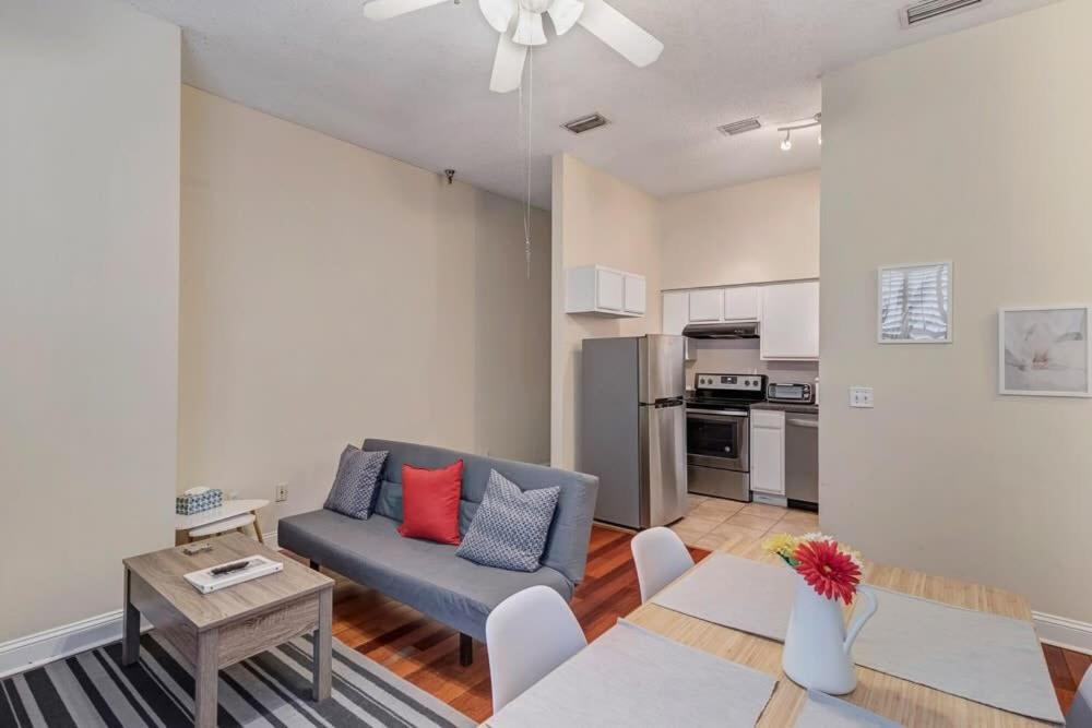 a living room with a couch and a table at LT Stay Discounts! Cozy 2 BR Apt - Pet Friendly! in Jacksonville