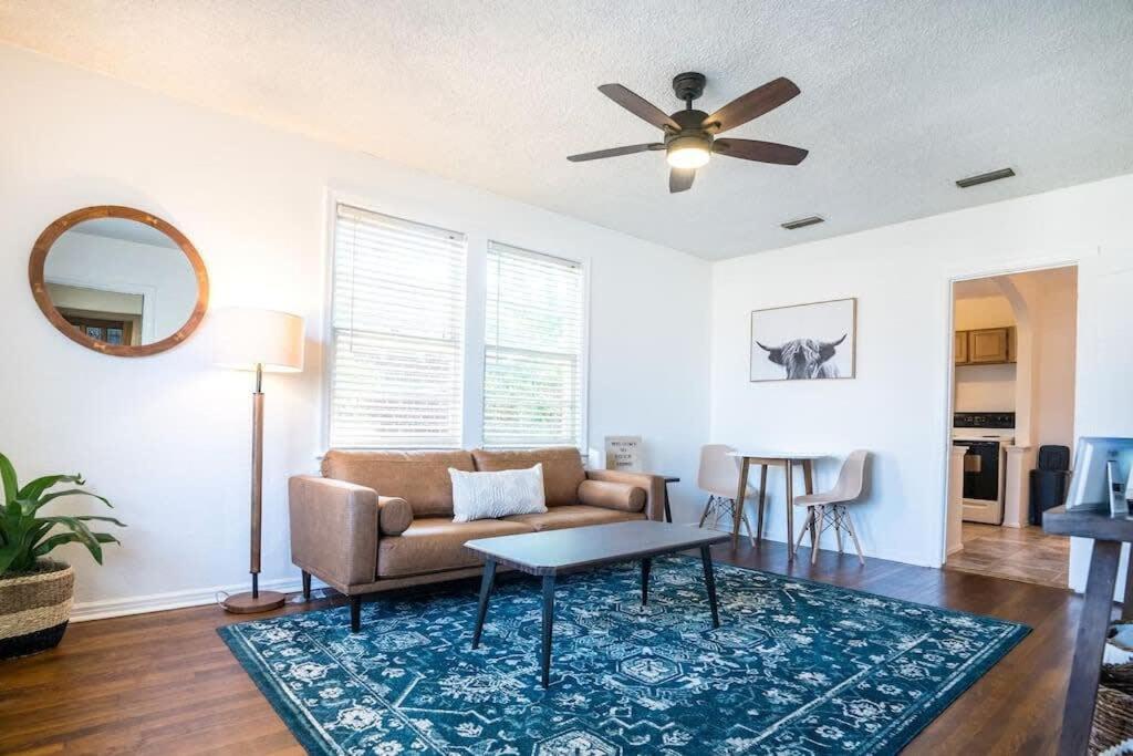 a living room with a couch and a ceiling fan at Charming Riverside Retreat 1 1 - Near 5 Points #3 in Jacksonville