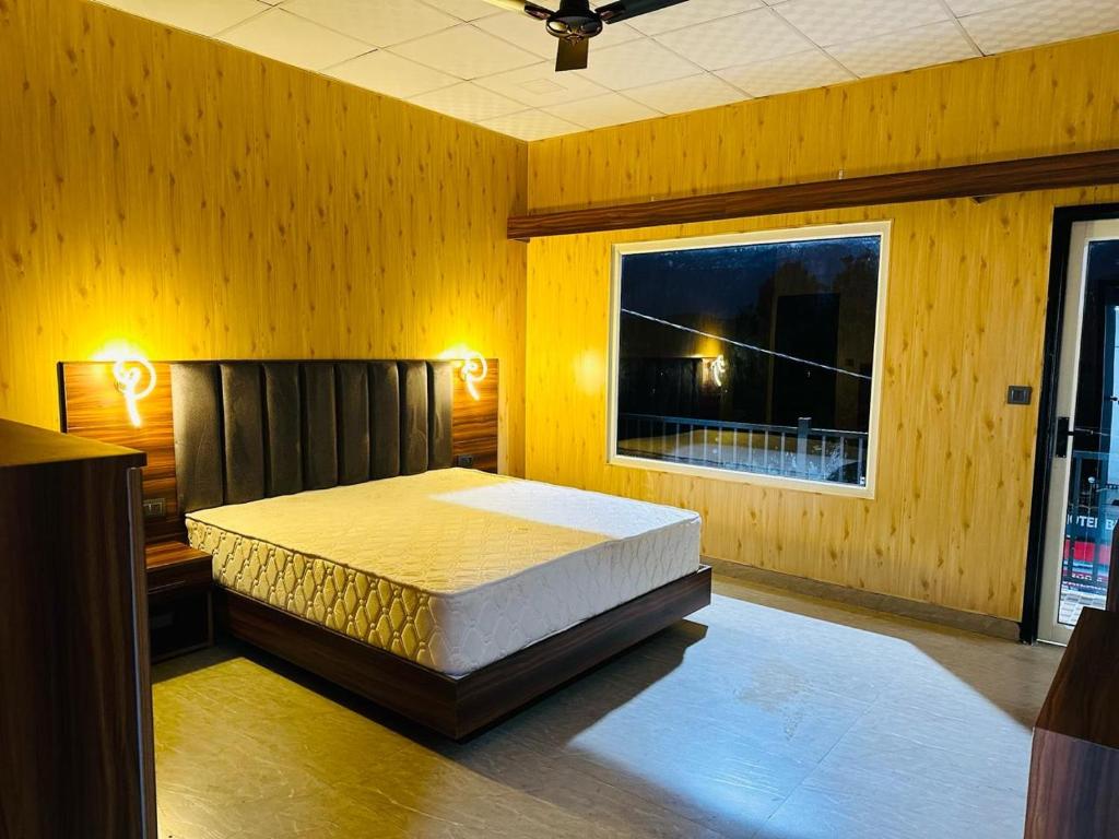 Кровать или кровати в номере RG Castle