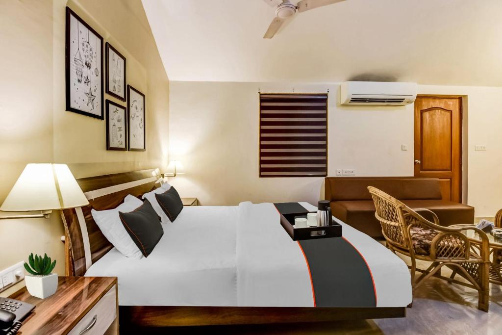 Кровать или кровати в номере Collection O Hotel Sangia