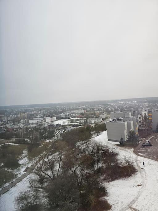 a view of a city with snow on the ground at Gražus ir ramus butas jonavoje in Jonava