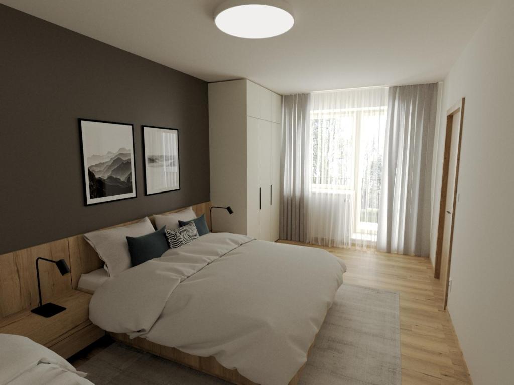 Postel nebo postele na pokoji v ubytování Elisa Apartment