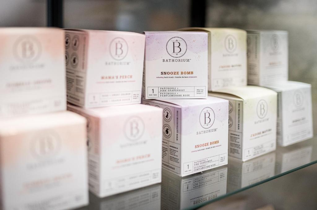 a pile of boxes sitting on a shelf at Kyriad Prestige Residence & Spa Cabourg-Dives-sur-Mer in Dives-sur-Mer