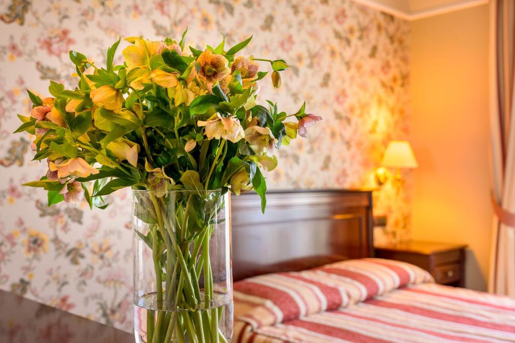 Postel nebo postele na pokoji v ubytování Boutique Splendid Hotel