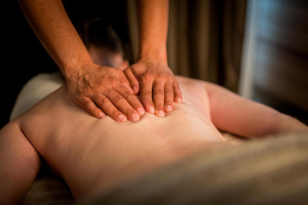 a man with his hands on his back at Kyriad Prestige Residence & Spa Cabourg-Dives-sur-Mer in Dives-sur-Mer