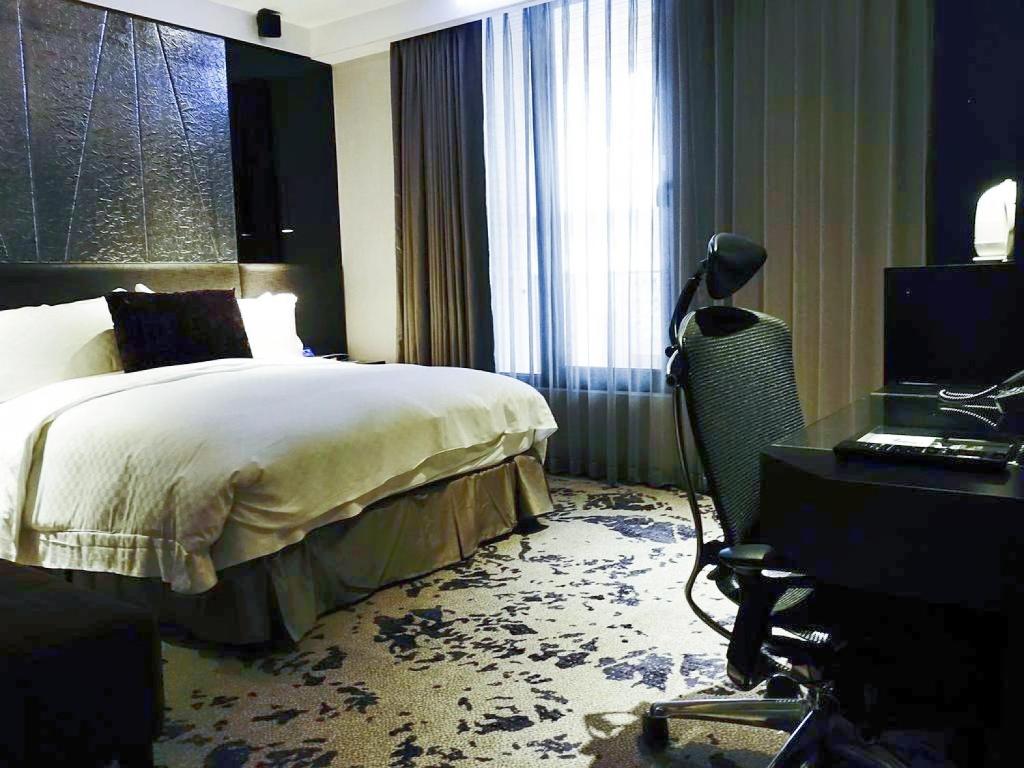 Postel nebo postele na pokoji v ubytování The Tango Hotel Taipei ChangAn