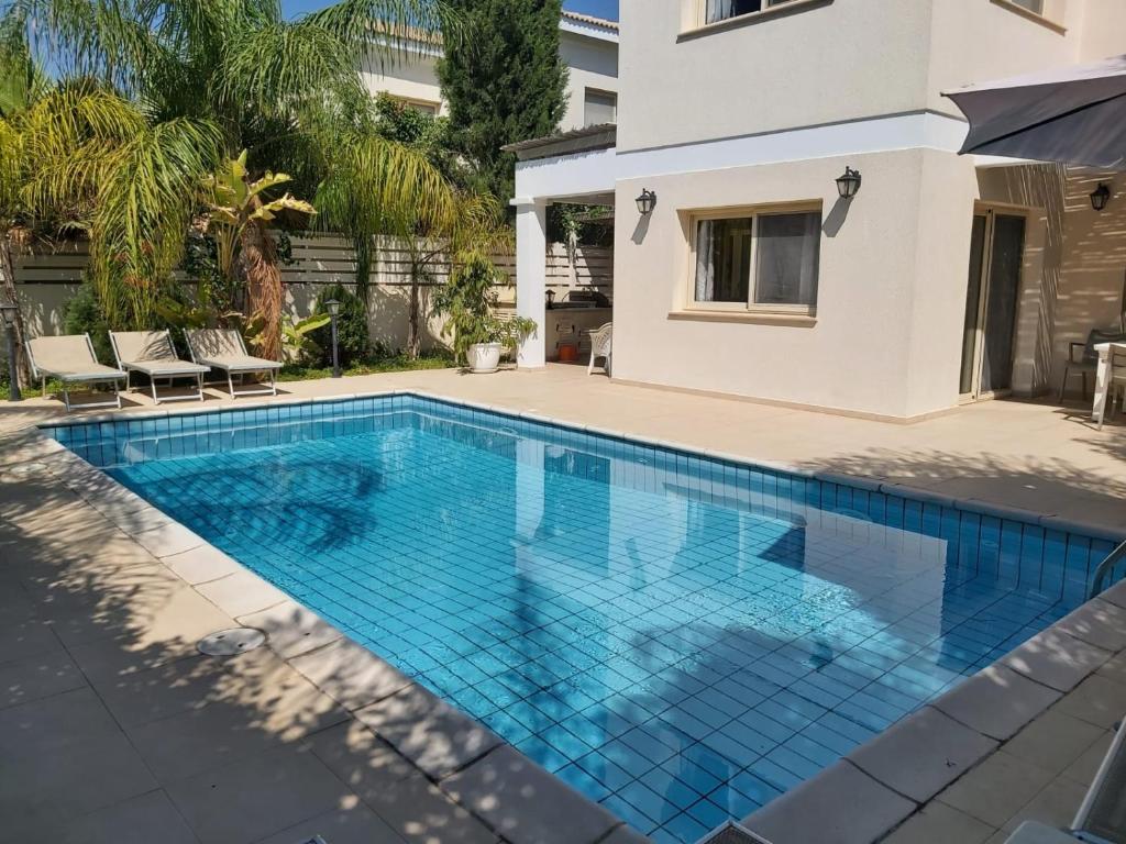 a swimming pool in the backyard of a house at ANTHORINA VILLA 9 in Protaras