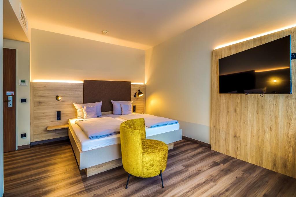Postel nebo postele na pokoji v ubytování Lagovida Das Ferienresort Am Störmthaler See