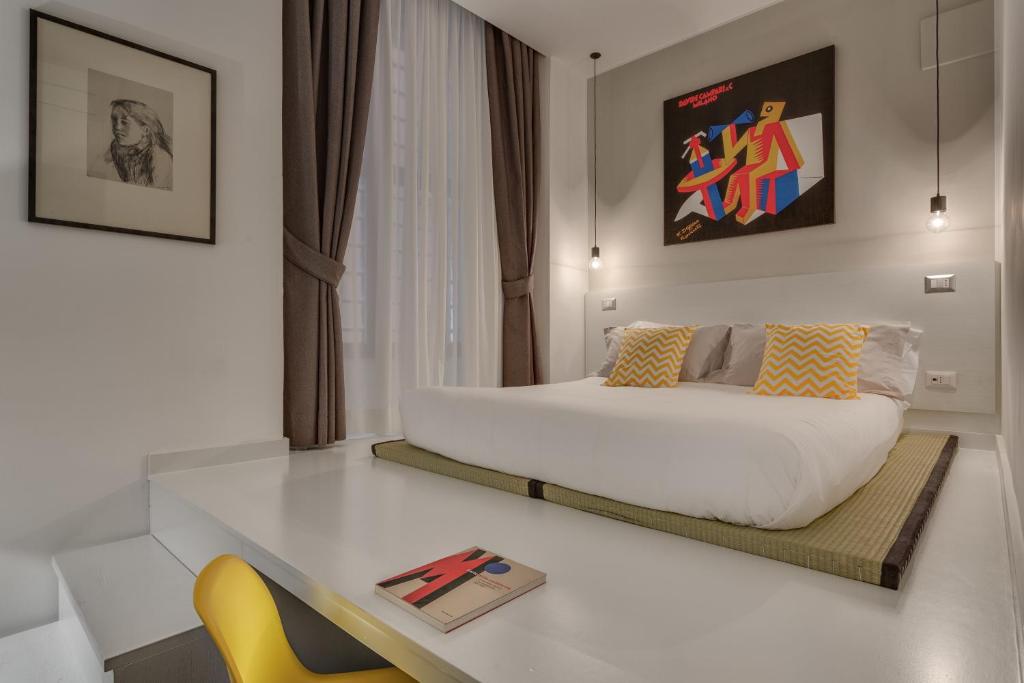 Postel nebo postele na pokoji v ubytování Navona Theatre Hotel