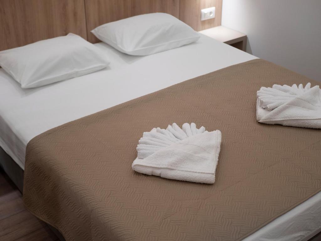 Postel nebo postele na pokoji v ubytování Apartments Mary
