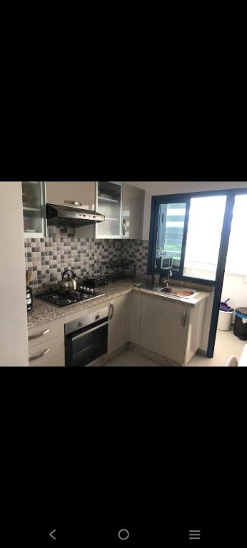 Kuchyň nebo kuchyňský kout v ubytování Appartement costa mar Martil
