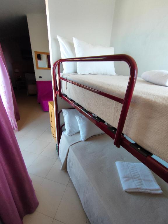 Postel nebo postele na pokoji v ubytování Hotel Belvedere Mindelo, Cabo Verde