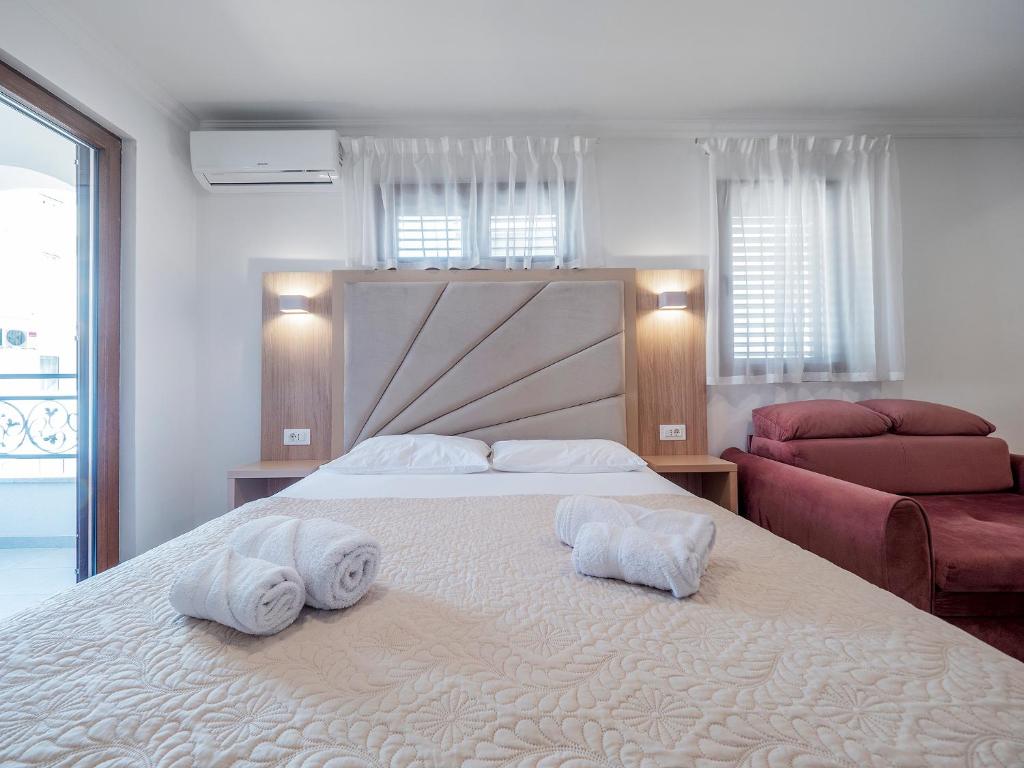 Postel nebo postele na pokoji v ubytování Apartments Mary