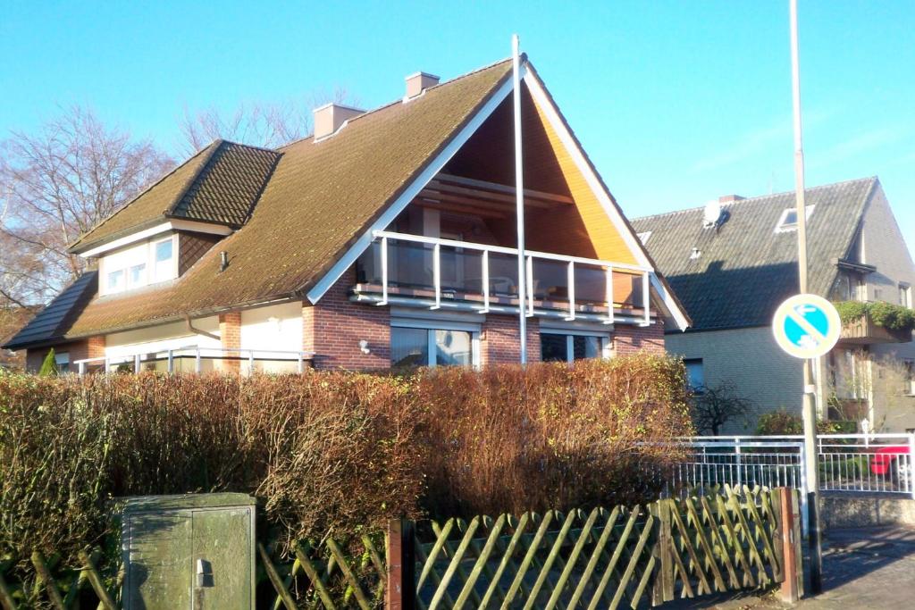 a large house with a gambrel roof at Haus Petra - Fewo 1 in Dahme