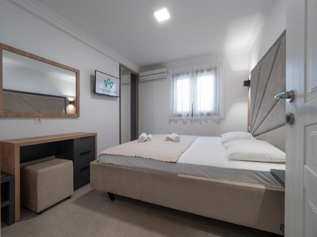 Postel nebo postele na pokoji v ubytování Apartments Mary