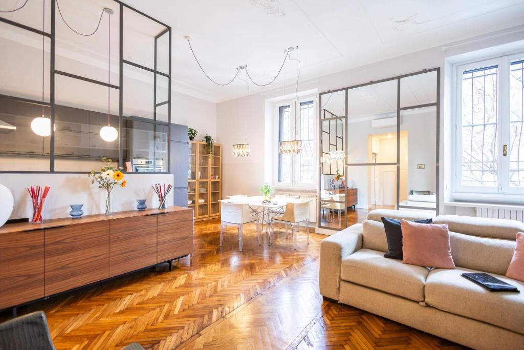 a living room with a couch and a table at Parco Vittadini Apartment in Milan