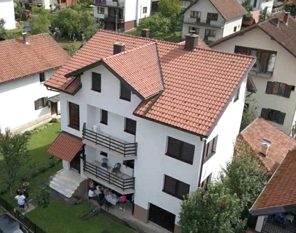 an aerial view of a white house with red roofs at Apartments D&S Bajina Basta with barbicue in Bajina Bašta