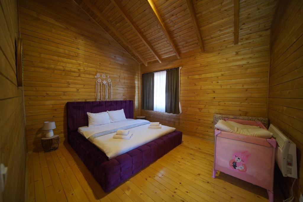 Postel nebo postele na pokoji v ubytování Bioland VILLA's