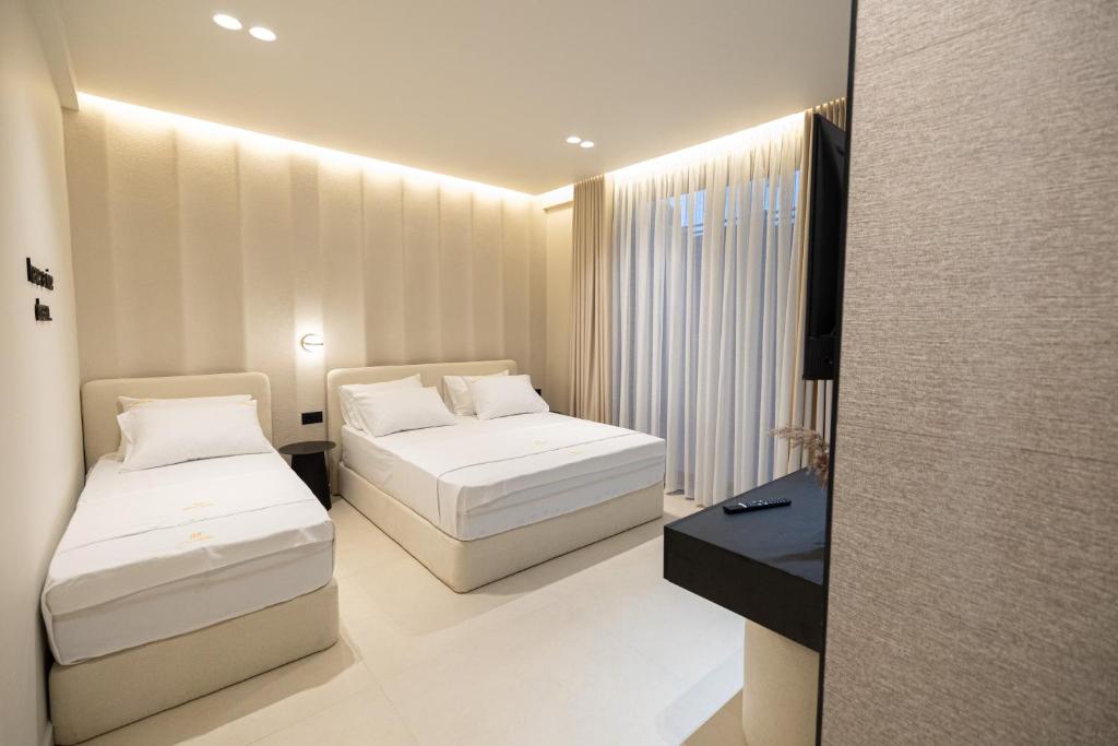 Postel nebo postele na pokoji v ubytování Hotel Beke