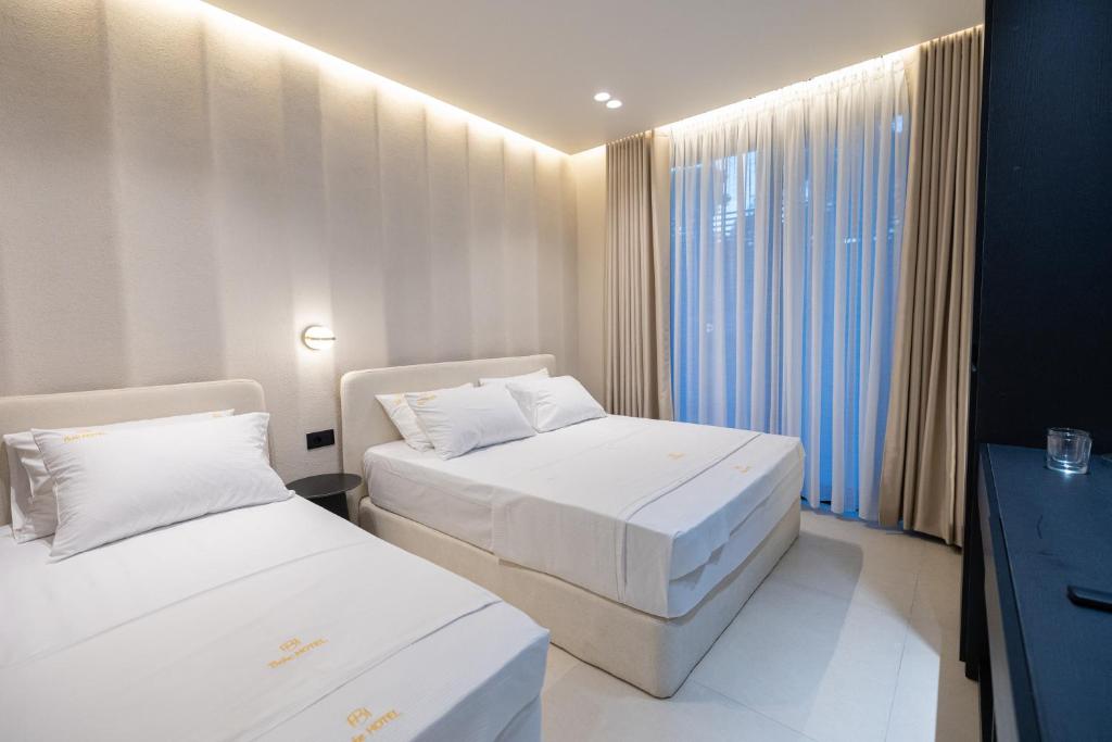Postel nebo postele na pokoji v ubytování Hotel Beke