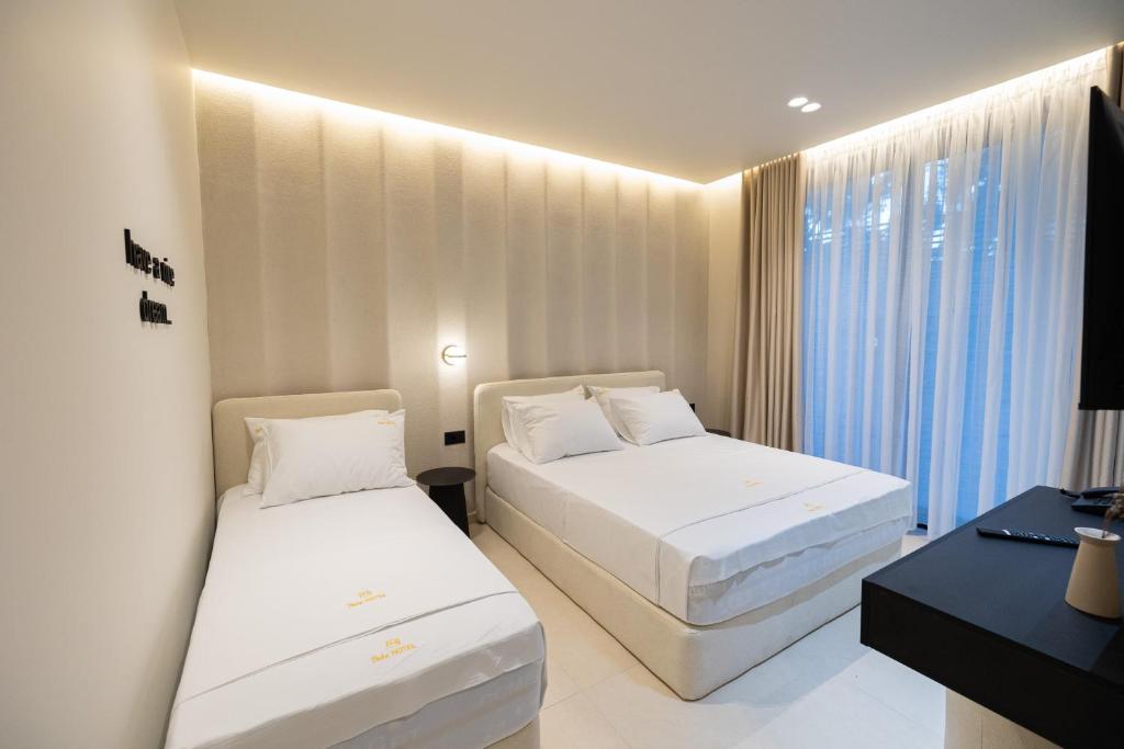Postel nebo postele na pokoji v ubytování Hotel Beke