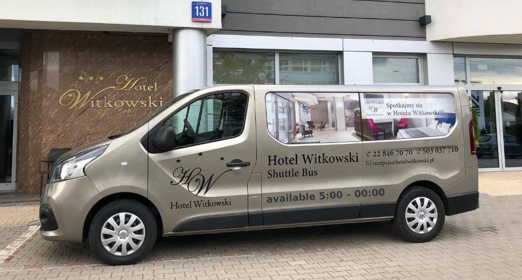 a silver van parked in front of a building at Hotel Witkowski in Warsaw