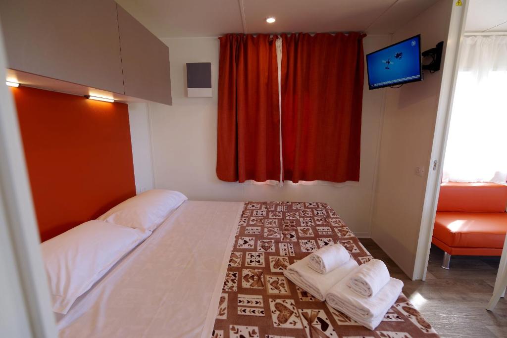 Postel nebo postele na pokoji v ubytování Camping Verona Village