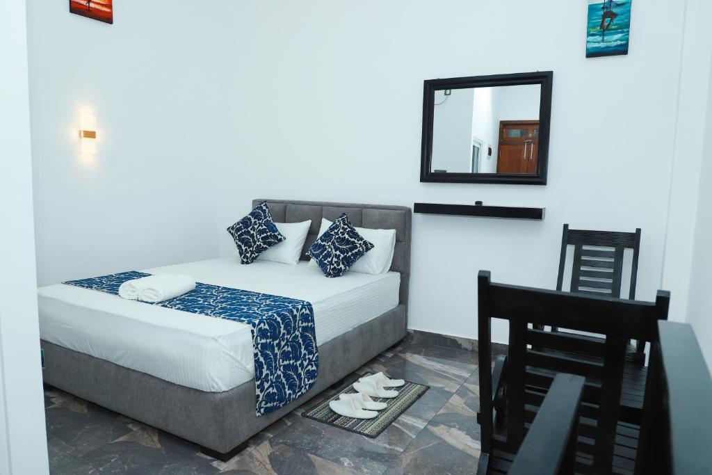 Postel nebo postele na pokoji v ubytování Airport Colombo Pocket Paradise