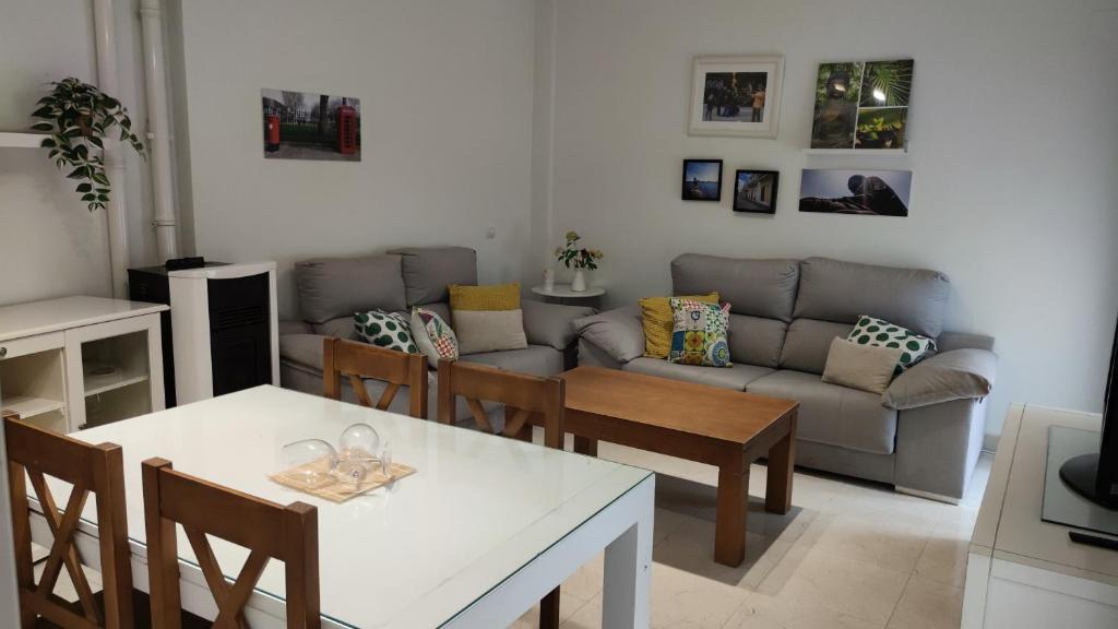 a living room with a couch and a table at Tahona in Carmona