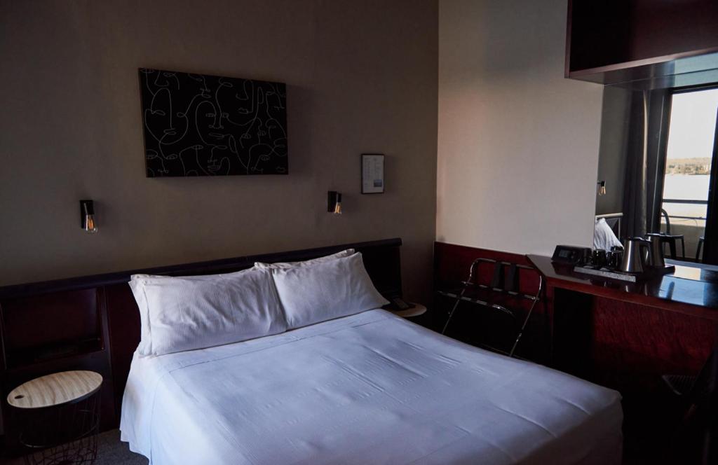 Postel nebo postele na pokoji v ubytování Hotel Concorde