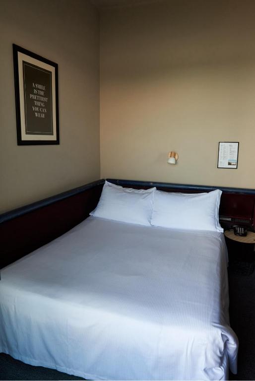 Postel nebo postele na pokoji v ubytování Hotel Concorde