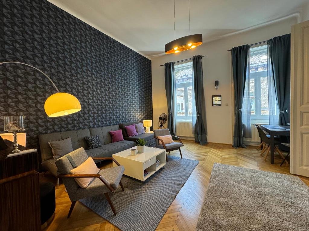 a living room with a couch and a table at Double Blue Apartment in Budapest Downtown in Budapest