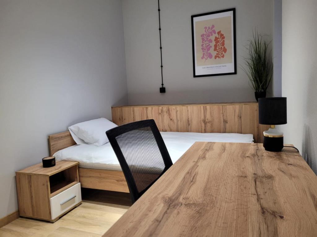 A bed or beds in a room at AXO-HOSTELS