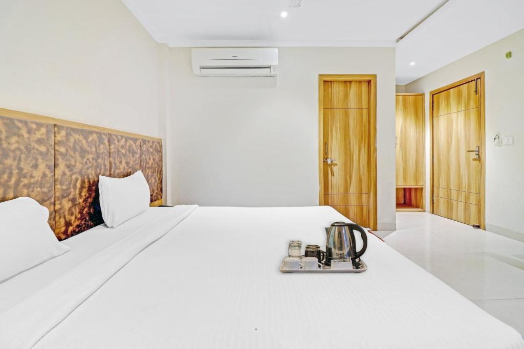 En eller flere senge i et værelse på OYO Townhouse 691 Hotel Sulit