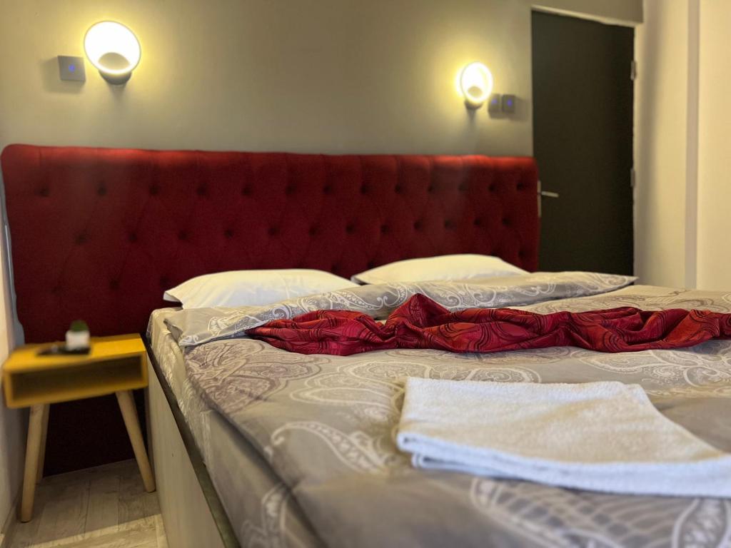 Postel nebo postele na pokoji v ubytování Aigi Rooms Vila