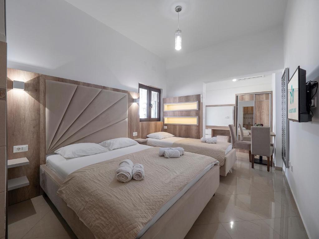 Postel nebo postele na pokoji v ubytování Apartments Mary