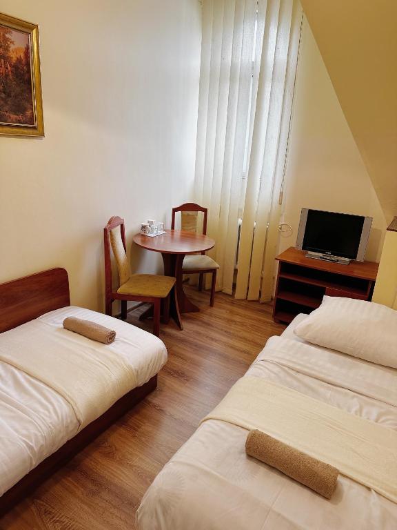 Posteľ alebo postele v izbe v ubytovaní Hotel Lubavia