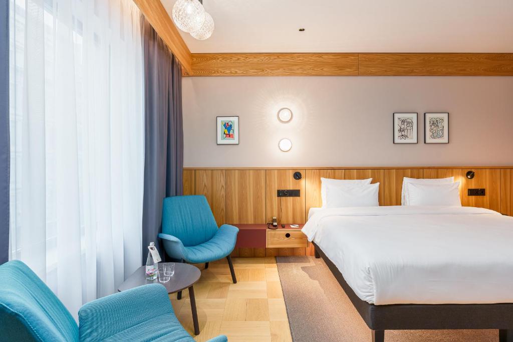 Postel nebo postele na pokoji v ubytování Aston Hotel Riga