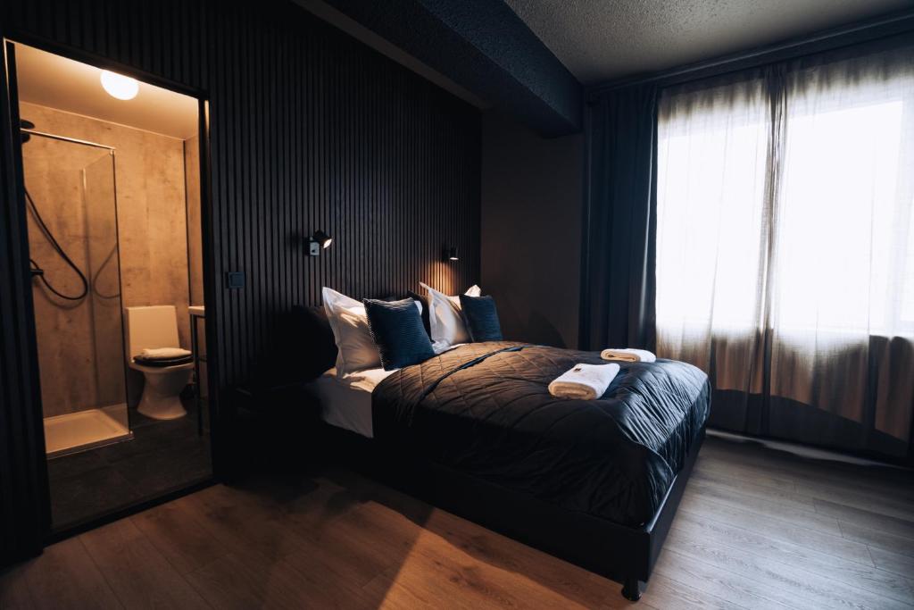 a bedroom with a bed and a window at Brim Hotel in Reykjavík